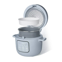 Cornflower blue rice cooker with open lid, removable inner pot, and perforated steam insert