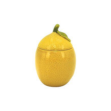 Yellow ceramic lemon candle with leaf-topped lid