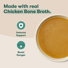 Small bowl of golden chicken bone broth sauce with health support icons