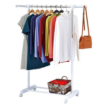 Rolling garment rack with multi-color clothes on hangers and a basket on the lower shelf