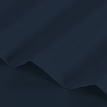 Navy microfiber sheet fabric with smooth weave and layered folds
