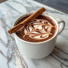 Cup of creamy instant café beverage with foam and cinnamon stick