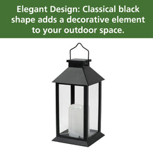 Black solar lantern with wide top canopy, glass panels, clear candle cylinder inside.