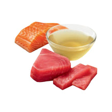 Tuna and salmon treat pieces with broth in a small dish