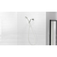White handheld showerhead with hose and chrome wall mount, wall-mounted spray head