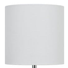 White linen drum shade with dark green glass base visible on Mainstays table lamp