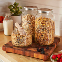 Ball mason jars with stainless lids, clear glass filled with assorted dry pantry foods