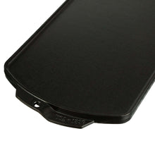 Cast iron griddle surface with raised edge and riveted handle tab