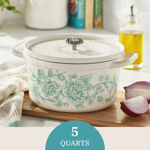 Green floral enameled Dutch oven with lid knob and two side handles