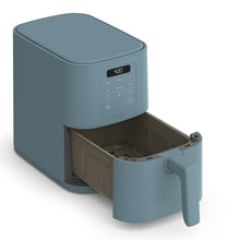 Surf blue air fryer with open drawer basket and visible cooking chamber