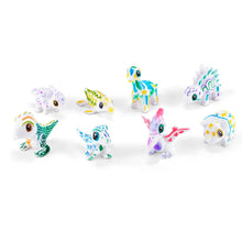 Colorful Scrubbie pet figurines with big eyes, nine small Dino pets