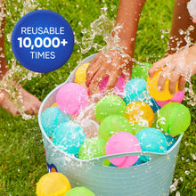 Reusable water balloons in a bowl, pink, blue, green, and yellow with splashes