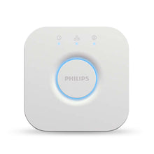 White Philips Hue lighting bridge hub with blue glowing ring and status icons