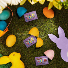 Easter grass with yellow and purple egg candies and M&M's Minis candy packets