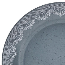 Blue stoneware plate rim with white lace pattern and speckled glaze