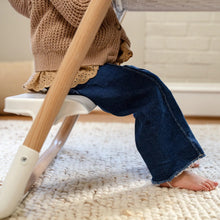 White step stool base with light-wood legs and wide platform for climbing