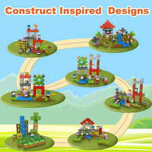 Magnetic block set creating multiple themed builds on small green platforms