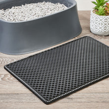 Black 2-layer cat litter sifting mat with raised waffle grid and trimmed edges