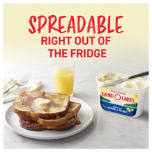 Spreadable butter right out of the fridge tub with toast and a glass