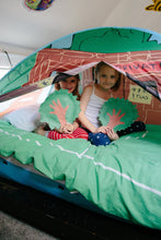 Tree house pop-up bed tent, kids seated inside with green bedding and blue entrance