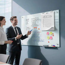 Magnetic glass whiteboard with sticky notes and colored magnets on a white writing surface