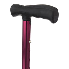 Folding cane handle close-up with black foam grip on red metallic shaft