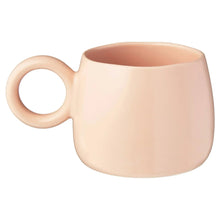 Light peach ceramic mug with round handle, plain front surface
