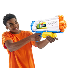 Child holding ZURU XSHOT water blaster toy, orange shirt, blue trigger grip