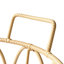 Close-up of woven poly rattan basket handles in light tan