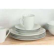 White ceramic coupe mug and stacked plates with coordinating bowls in a set.