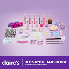 Colorful glam makeup kit contents: lip gloss tubes, powder, brushes, and hair accessories