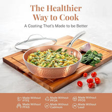 Copper hammered nonstick skillet with stainless lid, filled with cooked vegetables