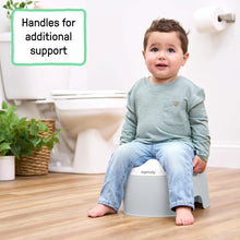 Grey toddler training potty with side handles and wide seat opening