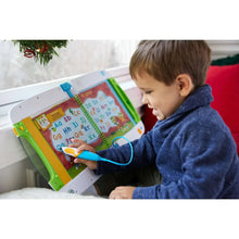 Child using a LeapFrog® LeapStart® learning system with a cable stylus