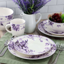 Porcelain place setting: patterned plate, bowl, and cup with purple rose floral design