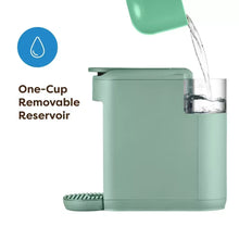 Keurig K-Mini Mate pod coffee maker in Glamping Green with pour stream from spout