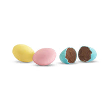 Candy coated milk chocolate eggs: yellow, pink, teal, and dark brown pieces