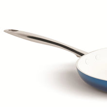 Denim blue ceramic non-stick saucepan with stainless lid and long wooden handle