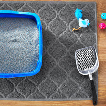 Gray litter trapper mat corner with looped texture and raised border