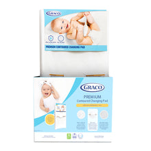 Graco contoured changing pad box with premium water-resistant pad and baby