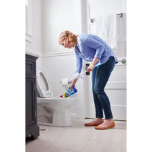 Person holding Clorox toilet bowl cleaner bottle near toilet bowl