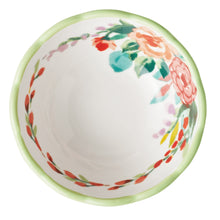Ceramic dip bowl with floral wreath rim in green and red-orange colors