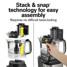 Black food processor base and clear bowl with stacked attachments for easy assembly