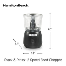 Compact black chopper with clear bowl lid and central stainless blade assembly