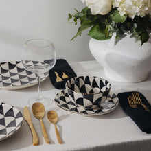 Black-and-white geometric ceramic bowls and plates set, assorted stack
