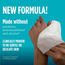 White pre-moistened washcloth held in hands with skin-gentle claim text