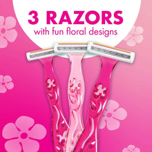 Three disposable women’s razors with pink floral-pattern handles, 3 blades each