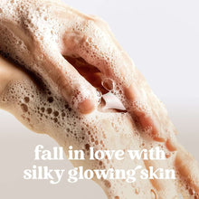 Foaming hand wash lather on hands with suds covering fingers