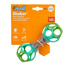 Green and clear Oball shaker rattle toy with two ball grips shown on card