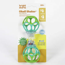 Green and clear shaker rattle toy in packaging with two ball grips
